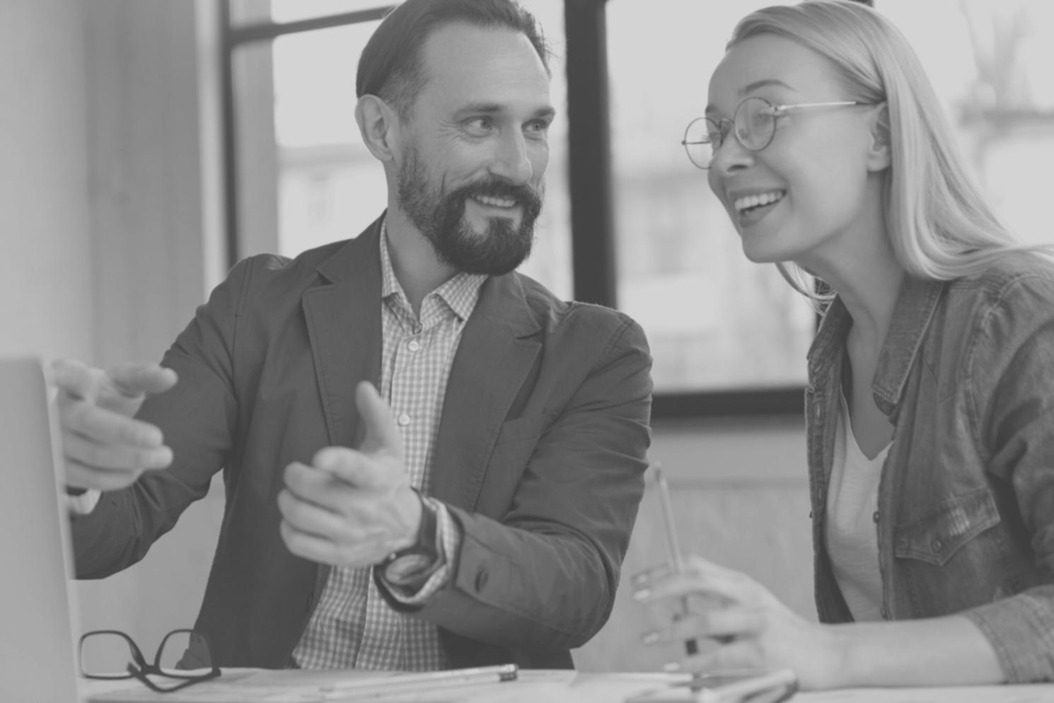 Business owner reviewing optimized budget reports showing successful cost reduction strategies