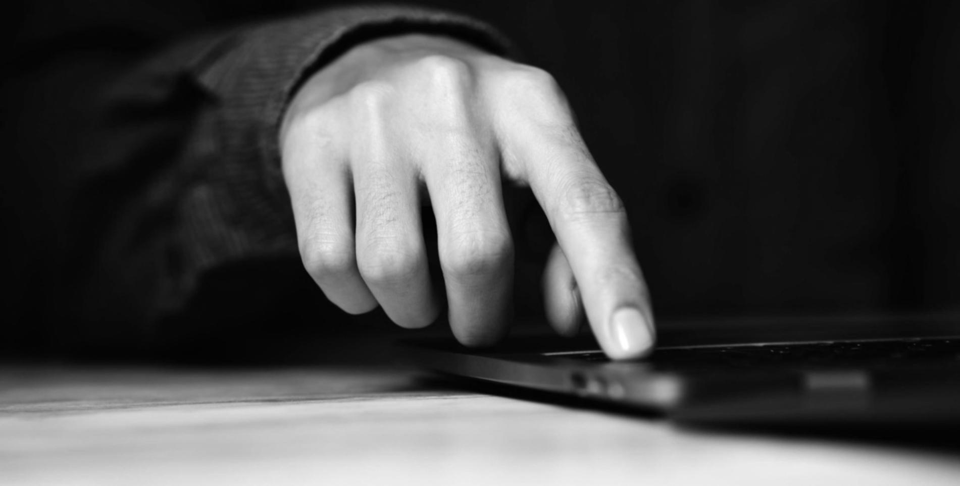 Person working with financial documents and calculator